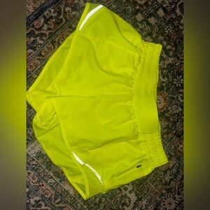 Lululemon shorts, size 6, never worn. Lime green/yellow